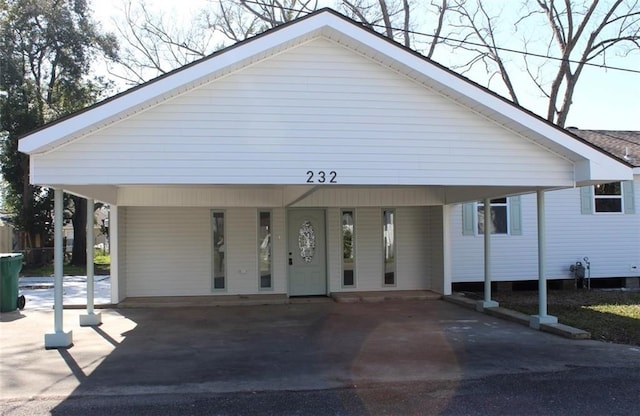 view of front facade with a carport