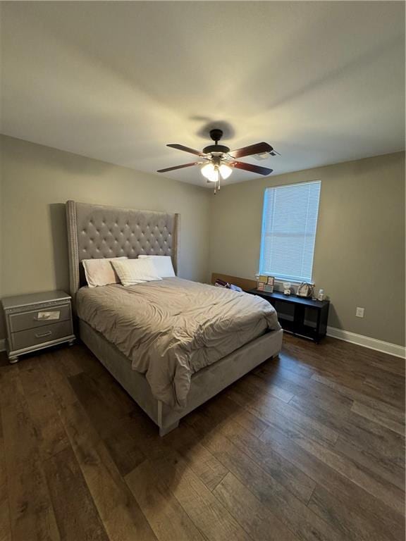 bedroom featuring ceiling fan and dark hardwood / wood-style flooring