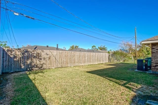 view of yard featuring central AC