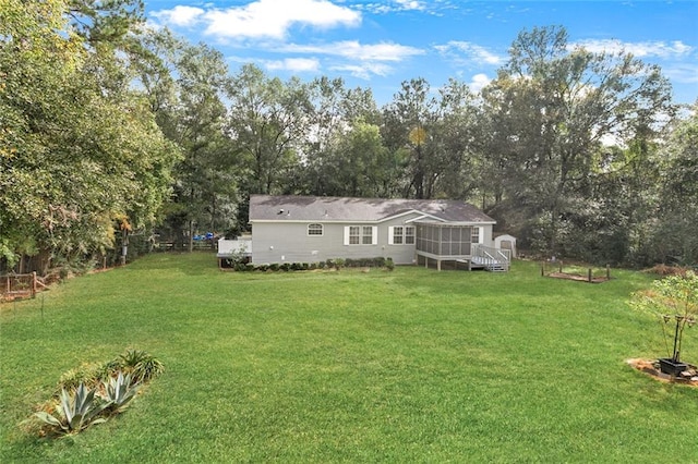 view of yard featuring a sunroom