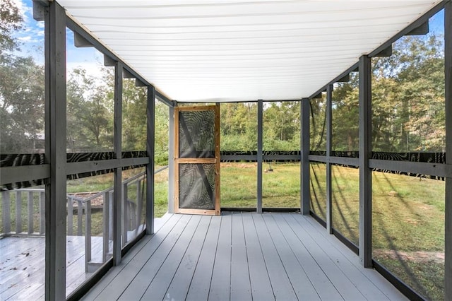 unfurnished sunroom featuring a wealth of natural light