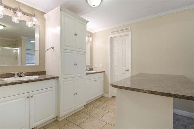 bathroom with a stall shower, a sink, two vanities, visible vents, and ornamental molding