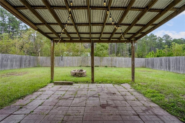 view of patio / terrace featuring an outdoor fire pit