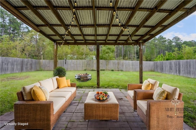 view of patio / terrace featuring an outdoor living space with a fire pit and a gazebo