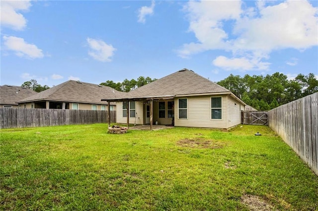 back of property featuring a patio area and a lawn