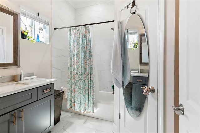 bathroom featuring shower / bath combo, vanity, and a healthy amount of sunlight