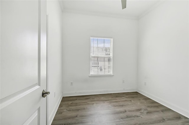 unfurnished room featuring hardwood / wood-style floors and ornamental molding