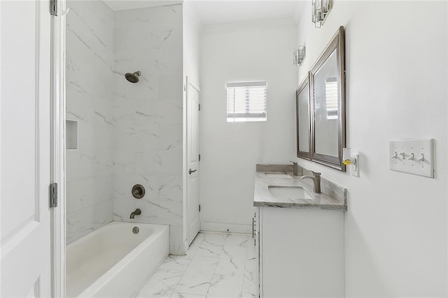 bathroom with vanity and tiled shower / bath combo