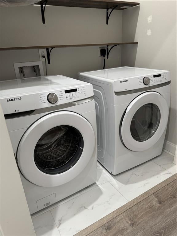 laundry room with washer and dryer