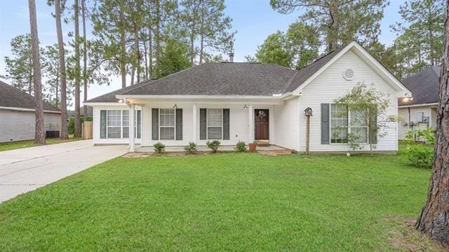 single story home featuring a front lawn