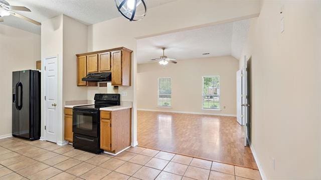 kitchen featuring black appliances, light wood-type flooring, and ceiling fan