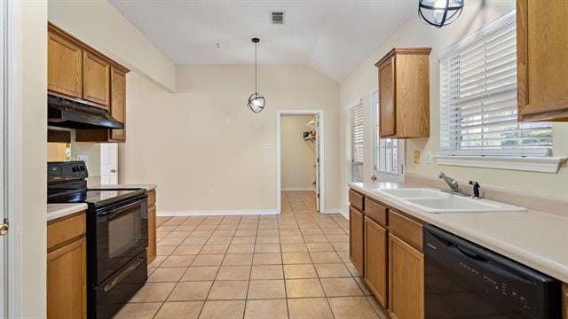 kitchen with black appliances, light tile patterned floors, pendant lighting, sink, and vaulted ceiling