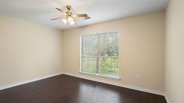 spare room with wood-type flooring, a textured ceiling, and ceiling fan