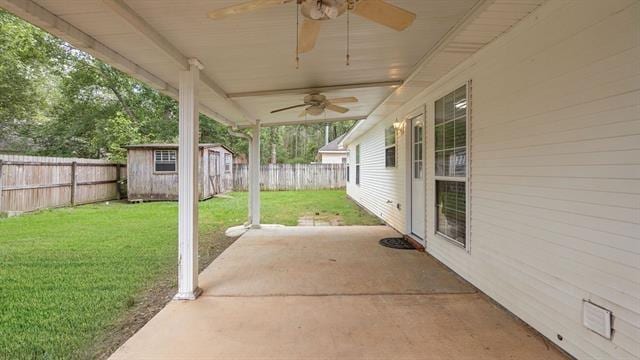 view of patio with a storage shed and ceiling fan