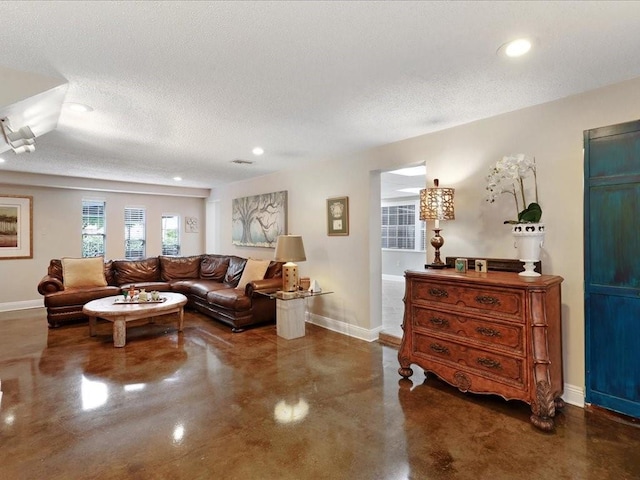 living room with a textured ceiling