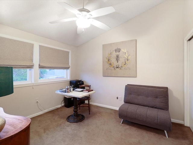 living area featuring ceiling fan, carpet, and lofted ceiling