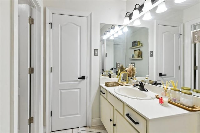 bathroom with vanity and tile patterned flooring