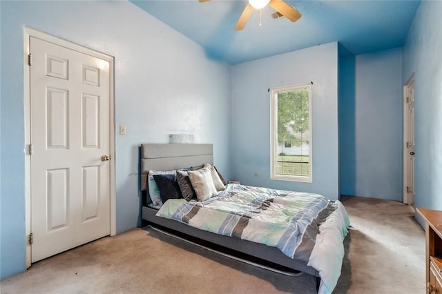 carpeted bedroom with ceiling fan