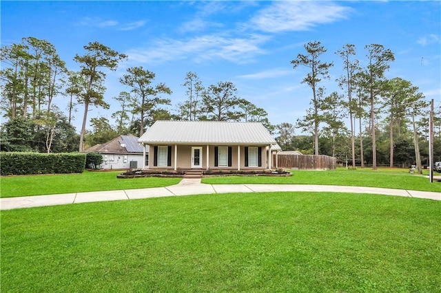 single story home featuring covered porch and a front yard