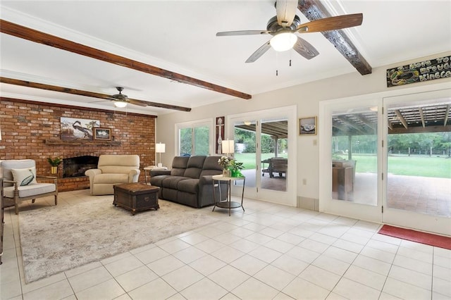 tiled living room featuring a brick fireplace, brick wall, beamed ceiling, and ceiling fan