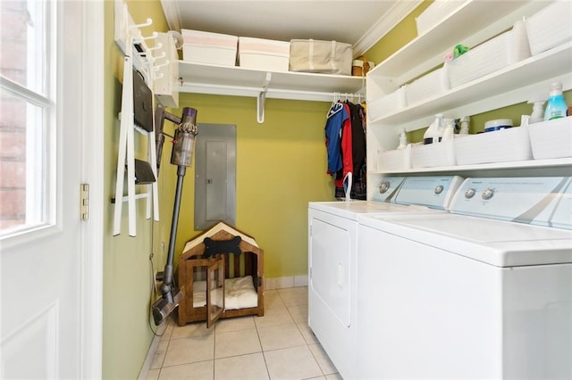 laundry area with light tile patterned flooring and washer and dryer