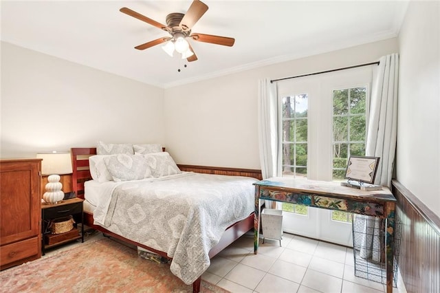 bedroom with a ceiling fan, light tile patterned floors, and crown molding
