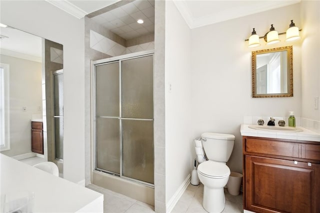 bathroom with vanity, crown molding, a shower with shower door, tile patterned floors, and toilet