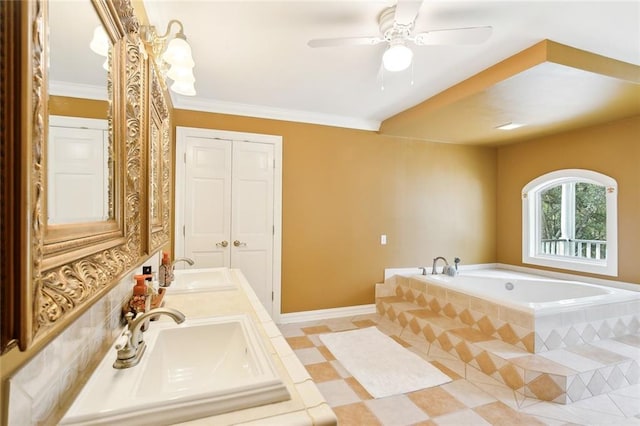 bathroom featuring tiled bath, ceiling fan, vanity, and crown molding