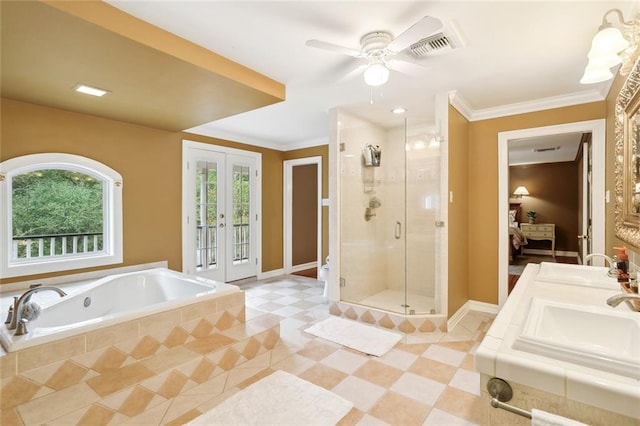 bathroom with french doors, separate shower and tub, ornamental molding, vanity, and ceiling fan