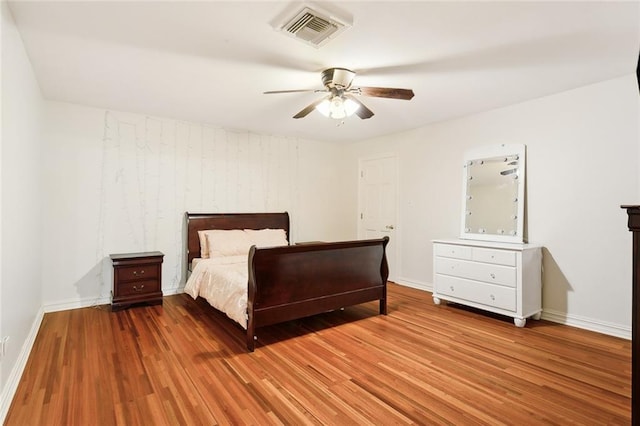 unfurnished bedroom featuring hardwood / wood-style floors and ceiling fan