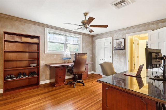 office space with ceiling fan, light hardwood / wood-style floors, and crown molding