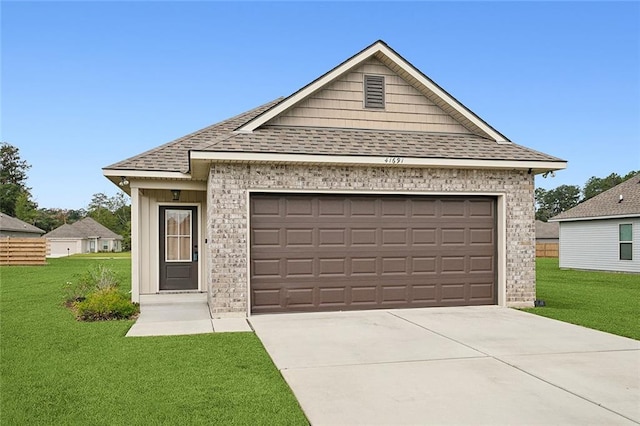 view of front of house with a front lawn and a garage