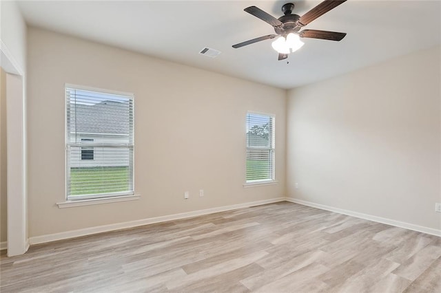 empty room with light hardwood / wood-style flooring and ceiling fan