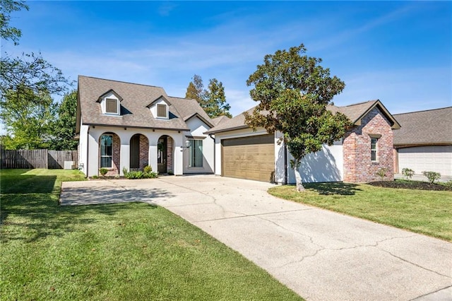 view of front of property featuring a garage and a front yard