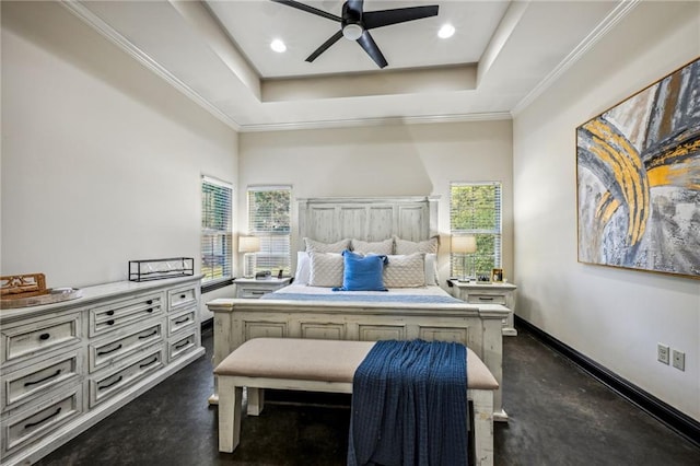 bedroom with ceiling fan, ornamental molding, and a tray ceiling