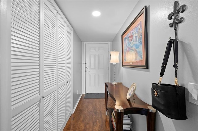 corridor with dark hardwood / wood-style floors