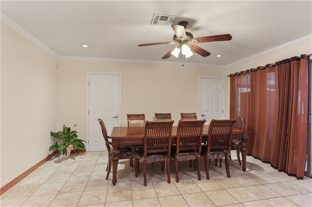 tiled dining space with ceiling fan and ornamental molding