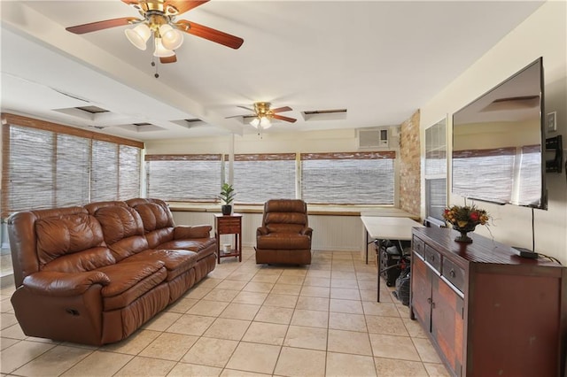 tiled living room with ceiling fan