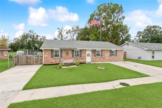 ranch-style home with a front lawn