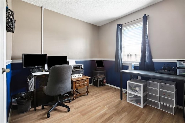 office space featuring a textured ceiling and hardwood / wood-style flooring