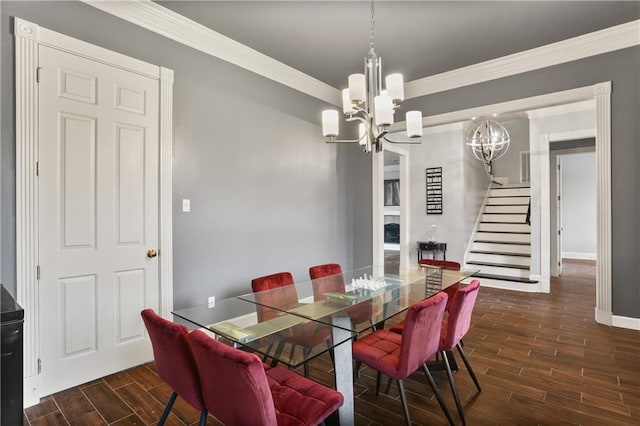 dining room with an inviting chandelier, dark hardwood / wood-style flooring, and ornamental molding