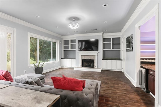 living room with dark hardwood / wood-style flooring, a fireplace, and crown molding