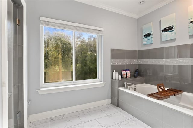 bathroom with a relaxing tiled tub and ornamental molding