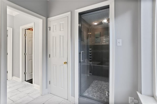 bathroom with a shower with shower door