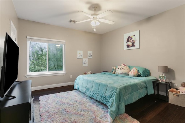 bedroom featuring dark wood-type flooring and ceiling fan