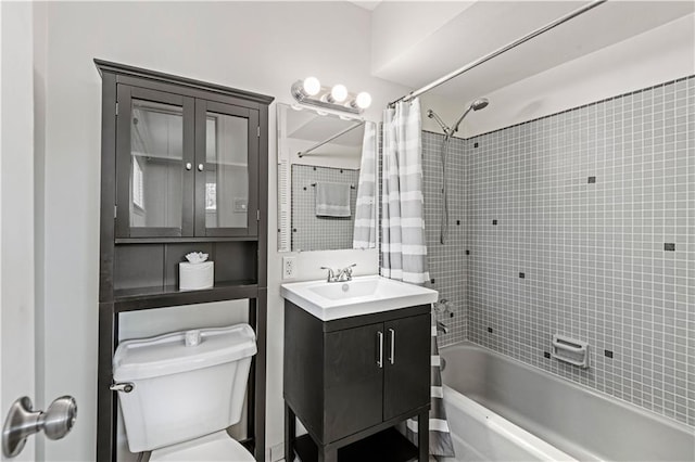 full bathroom featuring vanity, toilet, and shower / tub combo