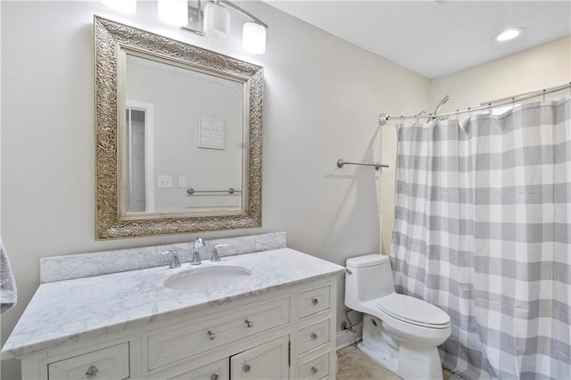 bathroom featuring vanity, toilet, and a shower with shower curtain