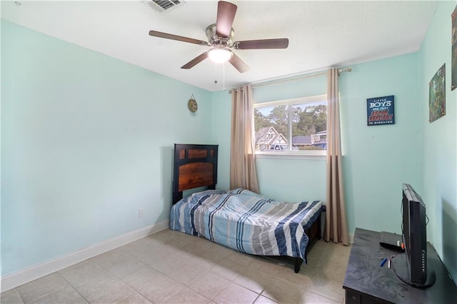 tiled bedroom with ceiling fan