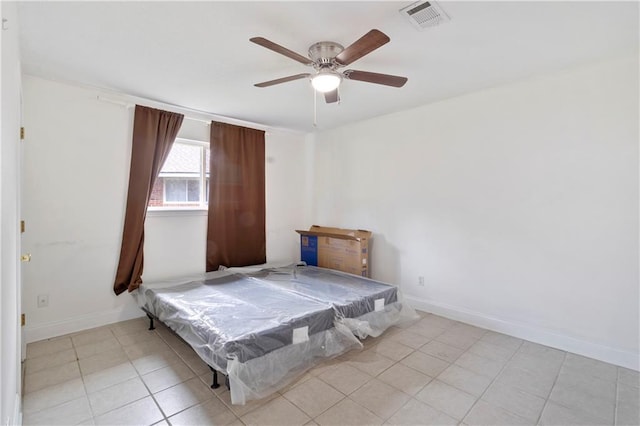 unfurnished bedroom featuring ceiling fan, light tile patterned floors, and pool table