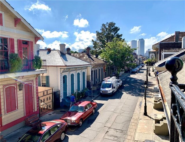 1225 Bourbon St Unit B, New Orleans, LA 70116 - view of asphalt street featuring sidewalks and curbs